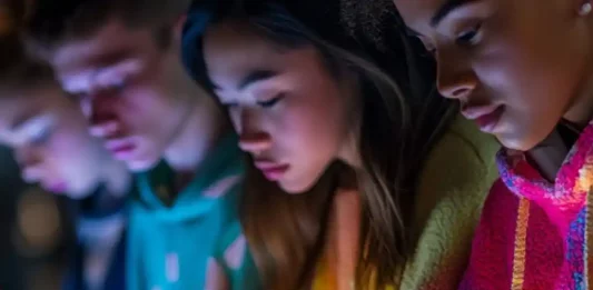 Young people use social media on mobile phones